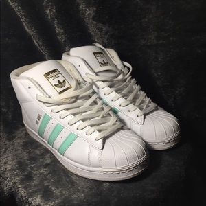 Mint and white adidas mids